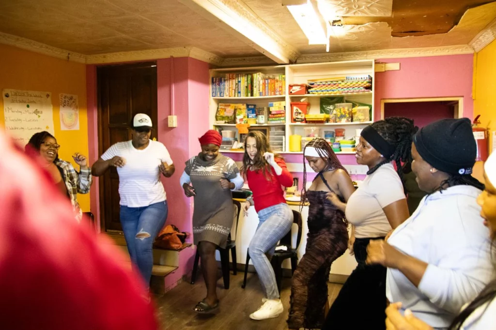 People dancing in a circle at one of the Sp(i)eel events hosted by The Anton Lubowski Educational Trust